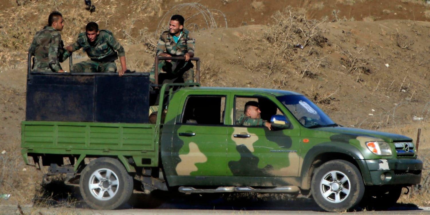Syriska soldater vid gränsövergången i juli i år, i samband med att området återerövrades från syriska regimmotståndare.