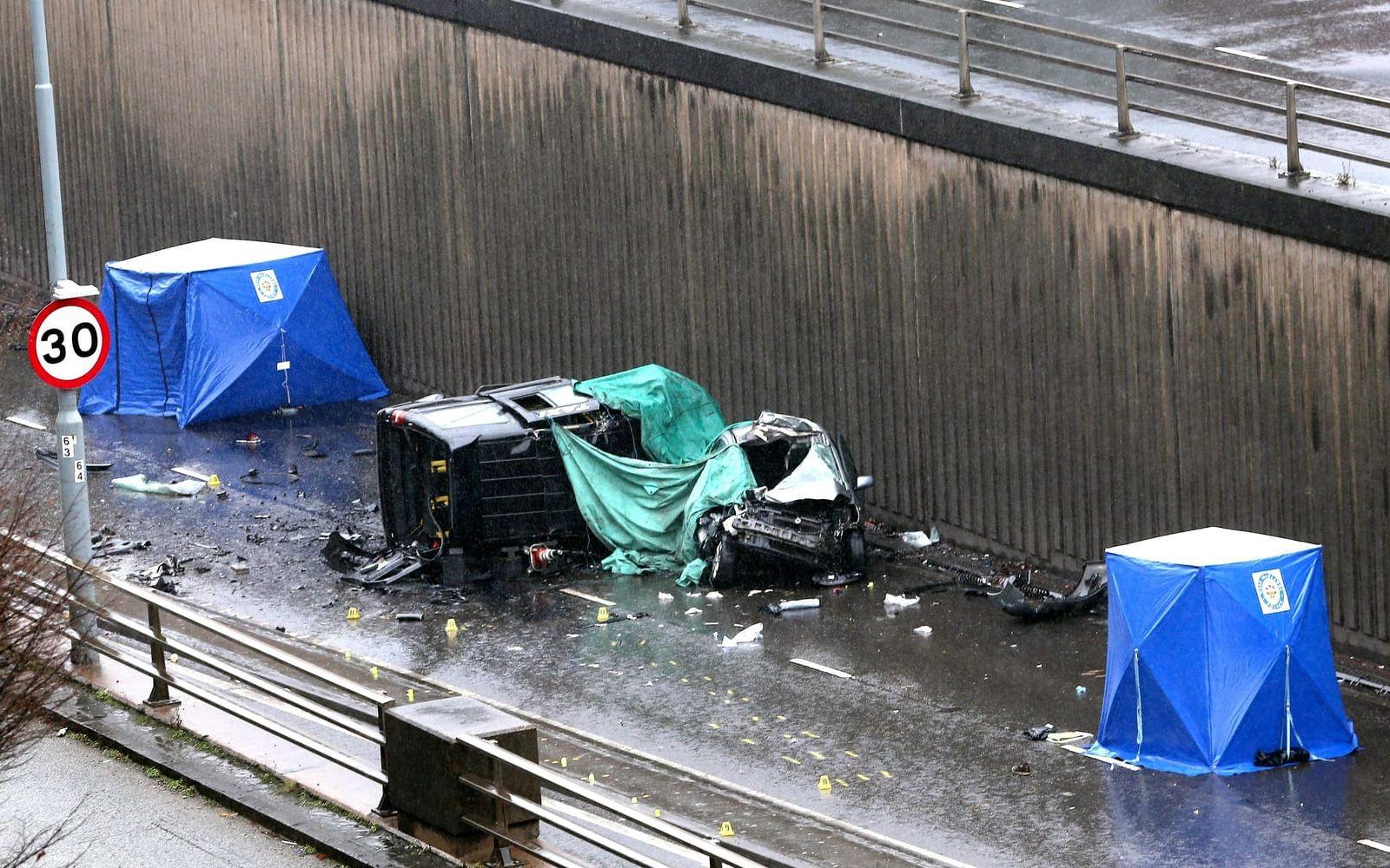 The scene of a multi vehicle crash at the entrance of an underpass near Edgbaston, in Birmingham, England, Sunday Dec. 17, 2017, which left six people dead and a seventh critically injured. (Aaron Chown/PA via AP)