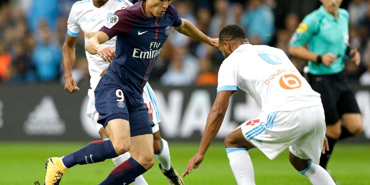 Edinson Cavani räddade en poäng till Paris Saint Germain mot Marseille när han satte en frispark på tilläggstid.