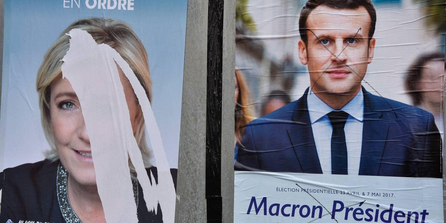 Såväl Nationella fronten Marine Le Pen som vänsterliberale Emmanuel Macron fått sina valaffischer vandaliserade.