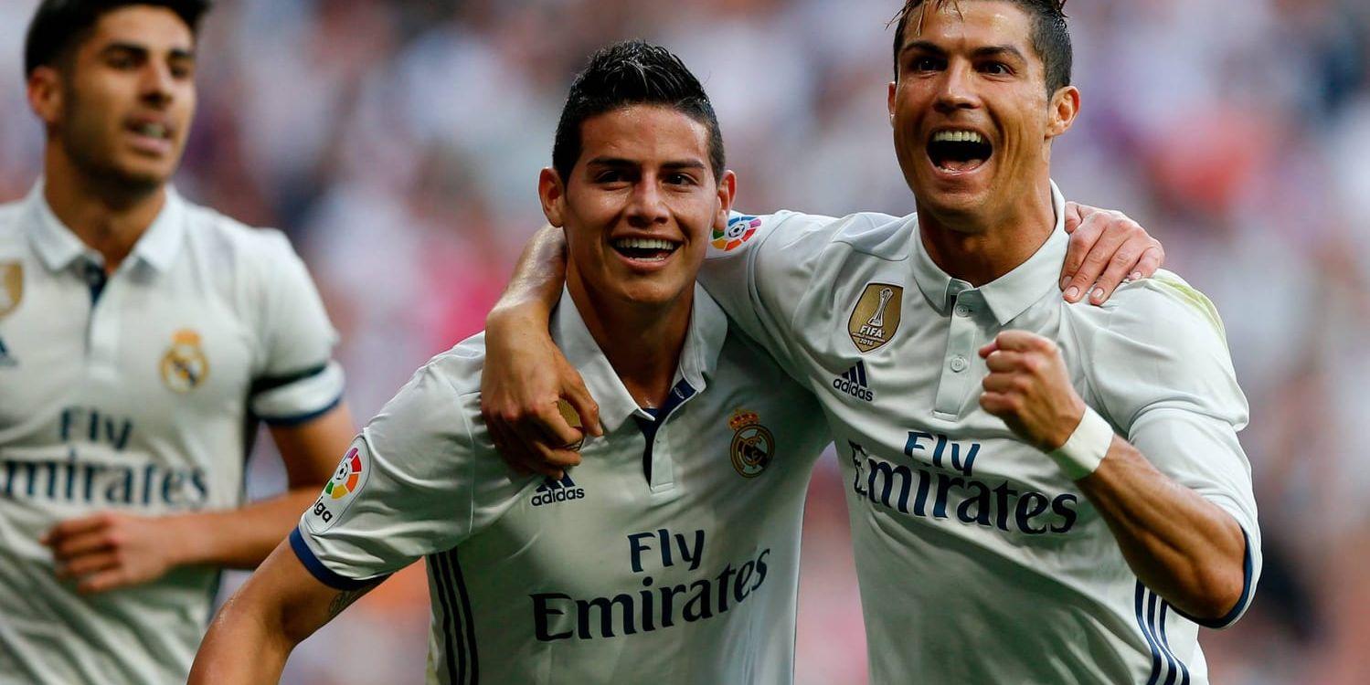 Cristiano Ronaldo (till höger) gjorde två mål mot Sevilla.