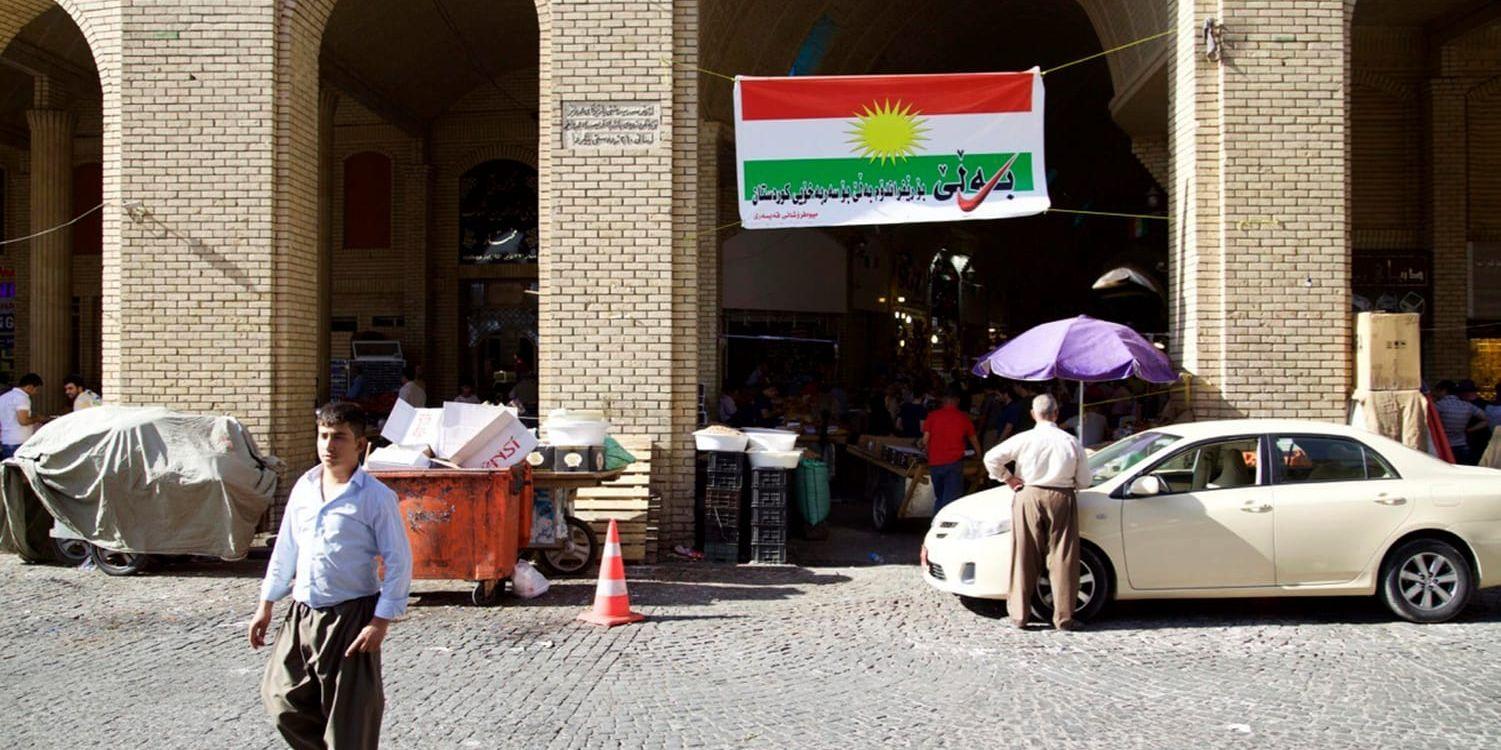 En kampanjflagga i Arbil manar folket att rösta ja till självständighet för irakiska Kurdistan.