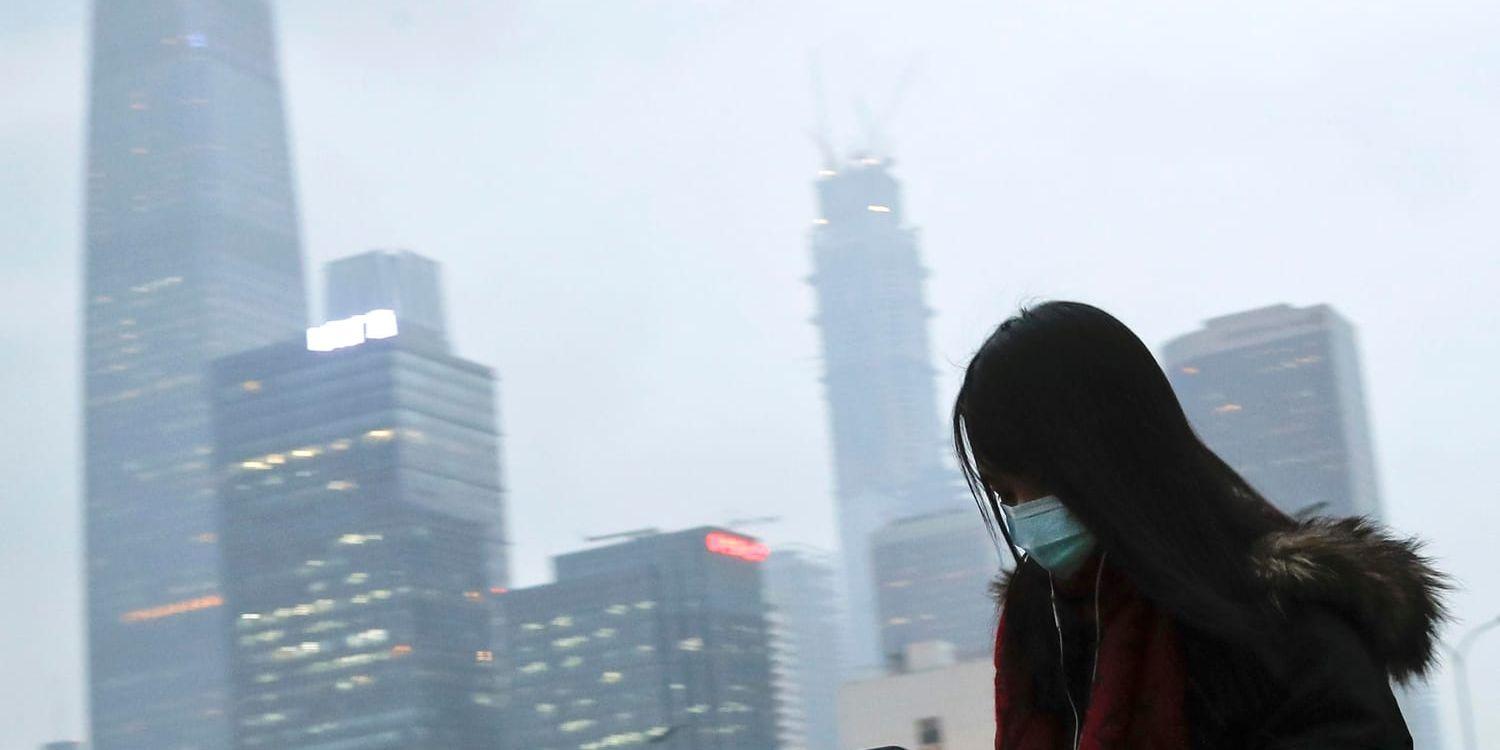 I Peking bär många andningsfilter i hopp om att lindra den värsta smoggen. Bild från februari i år.