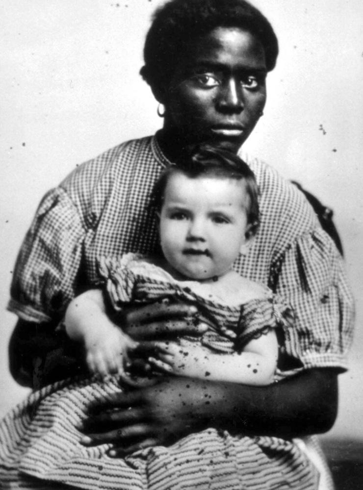 En slav med sin ägares barn i knät, cirka 1850. 