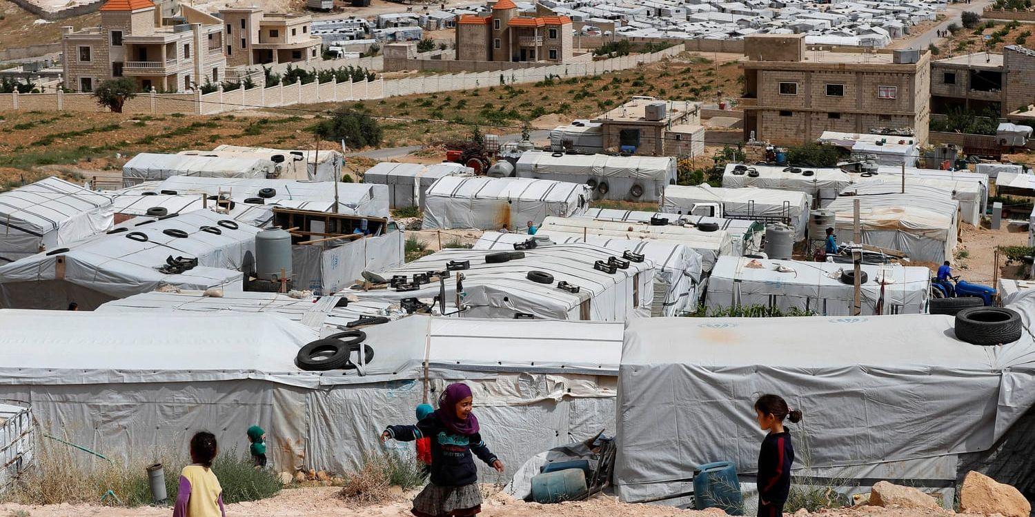 Syriska flyktingar i ett läger nära gränsen till Libanon. Arkivbild.