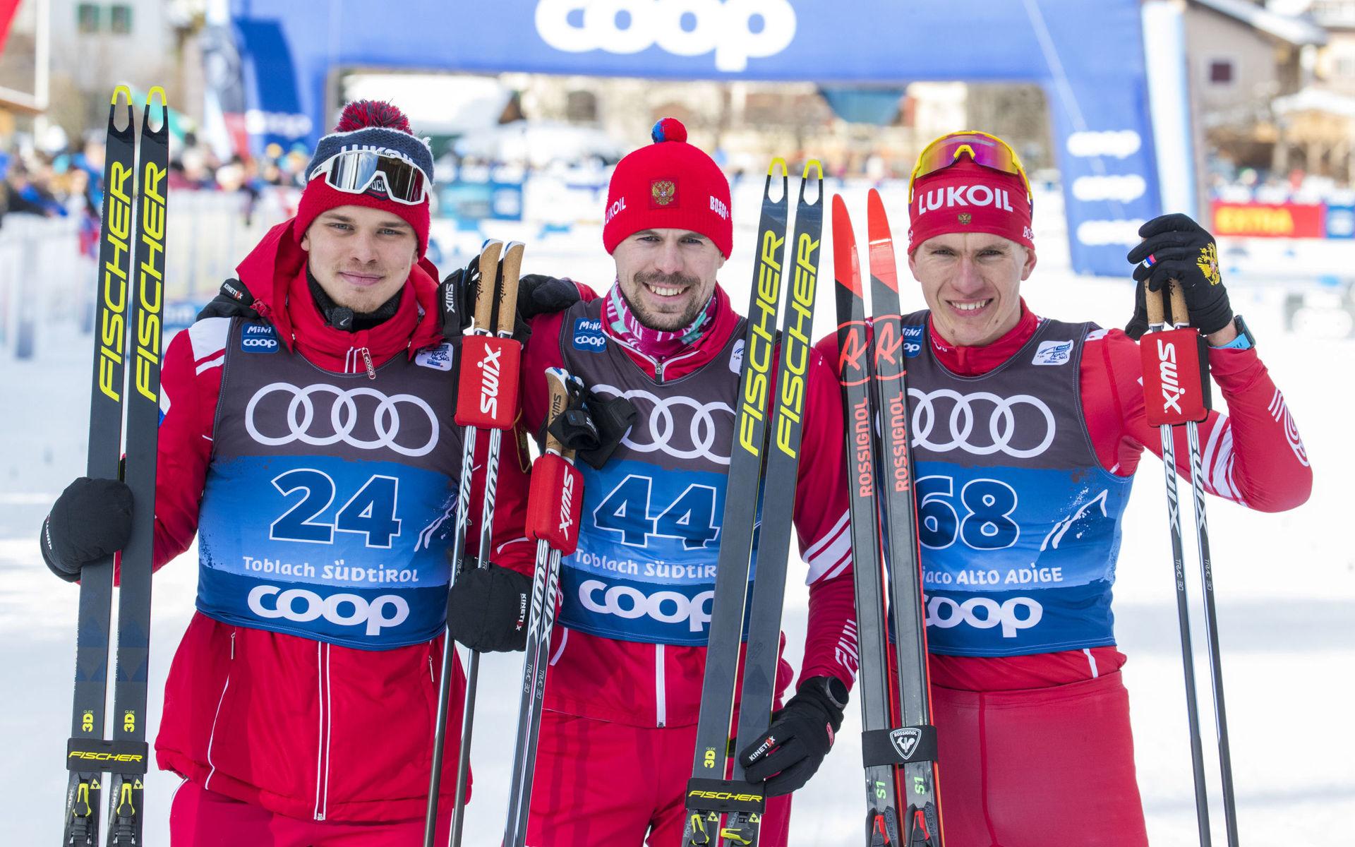 Ivan Jakimusjkin (tvåa), Sergej Ustiugov (etta) och Alexander Bolsjunov (trea) ordnade en rysk trippel på 15 kilometer fristil i Toblach under Tour de Ski i december. Men det är osäkert om någon av dem kommer att få tävla på VM och OS de närmaste åren. Arkivbild.